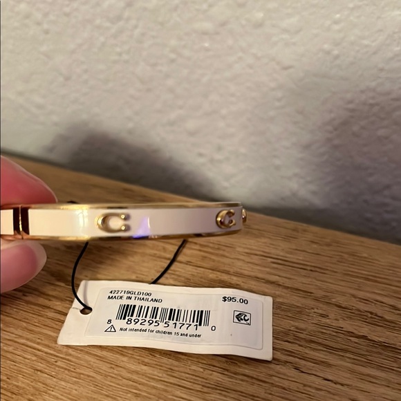 Coach Gold and White Bracelet. Has small crack in white paint on one side. - Picture 2 of 6